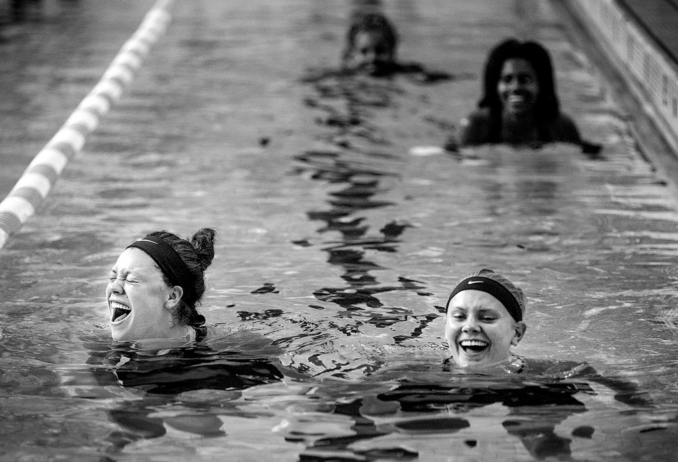 Rachel Banham and teammate Carlie Wagner enjoyed a lighthearted moment during a pool workout session on July 10, 2015 at University Aquatic Center.