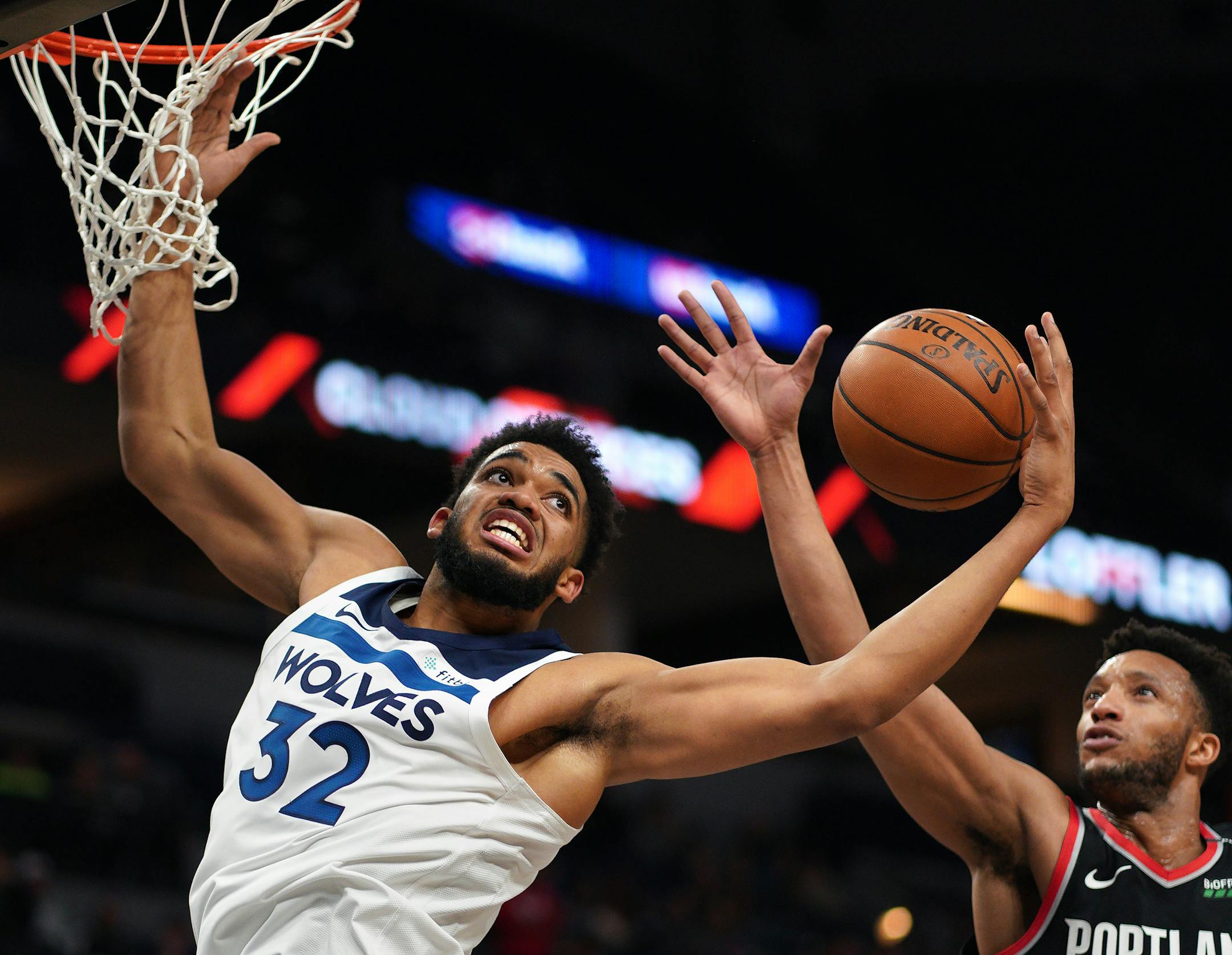 Timberwolves center Karl-Anthony Towns got his shot blocked by Portland's Evan Turner in the fourth quarter Monday.