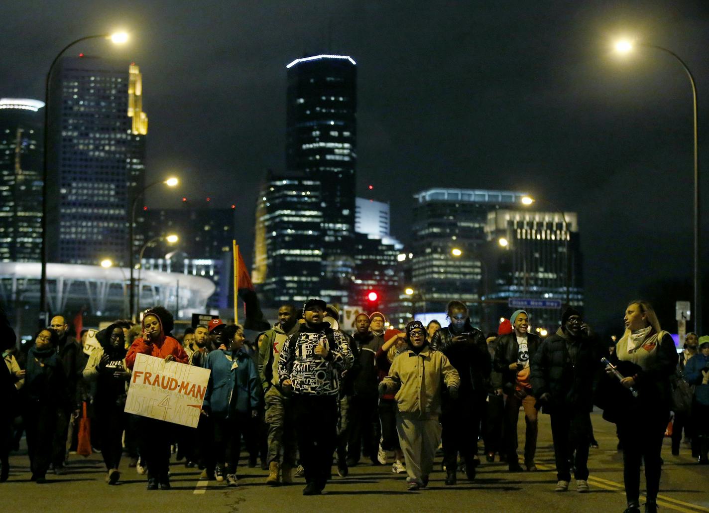 Protesters made their way tout of downtown Minneapolis to North Minneapolis. Evening marches and protests began in Minneapolis following the announcement that there will be no charges against Minneapolis police officers in the shooting death of Jamar Clark. ] CARLOS GONZALEZ cgonzalez@startribune.com - March 30, 2016, Minneapolis, MN, JUSTICE 4 JAMAR RALLY,