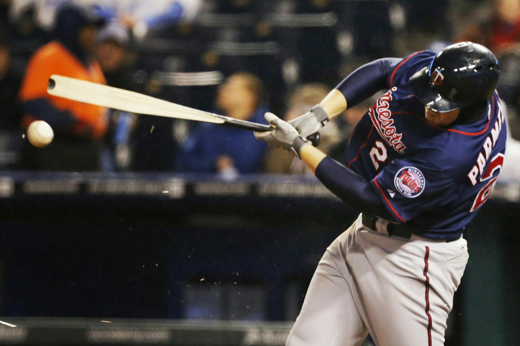 Minnesota Twins' Chris Parmelee hits a broken-bat single during the sixth inning of a baseball game against the Kansas City Royals at Kauffman Stadium in Kansas City, Mo., Wednesday, April 10, 2013. (AP Photo/Orlin Wagner)