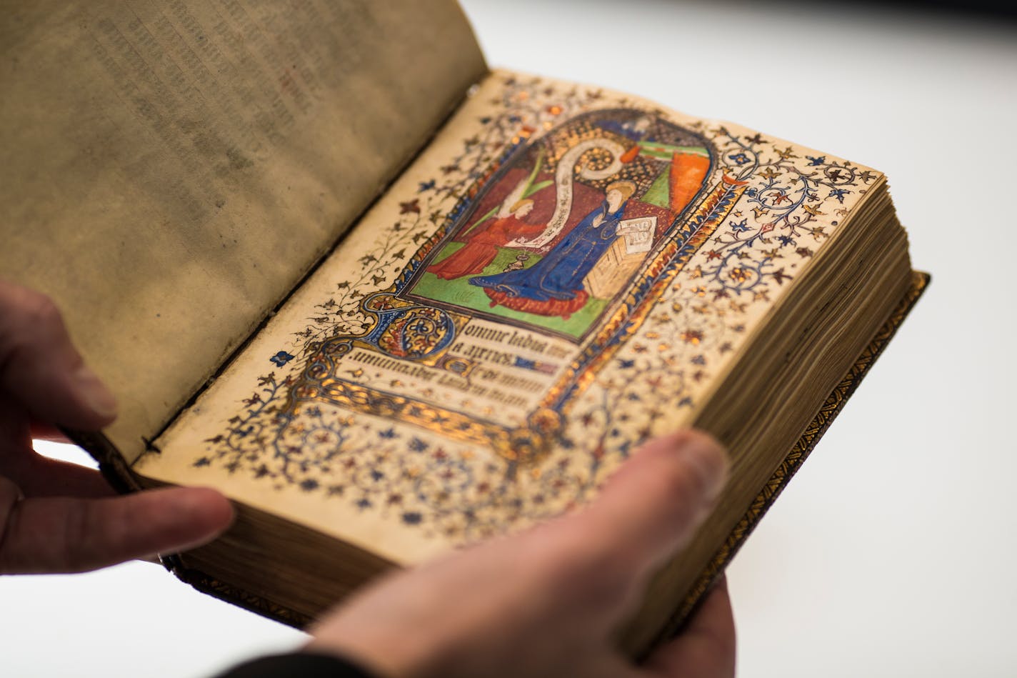 Fr. Columba Stewart held a 14th century book of hours from France at St. John's University in Collegeville, Minn., on Friday, December 1, 2017. Stewart has spent the past 20 years traveling the globe to unearth historically significant ancient writings and digitizing them. ] RENEE JONES SCHNEIDER ¥ renee.jones@startribune.com