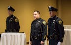 From the left; Officers Charles Cudd, Officer Todd Ewing and Officer Chad Miller stood for posting of the colors at the visitation for Officer Andrew 