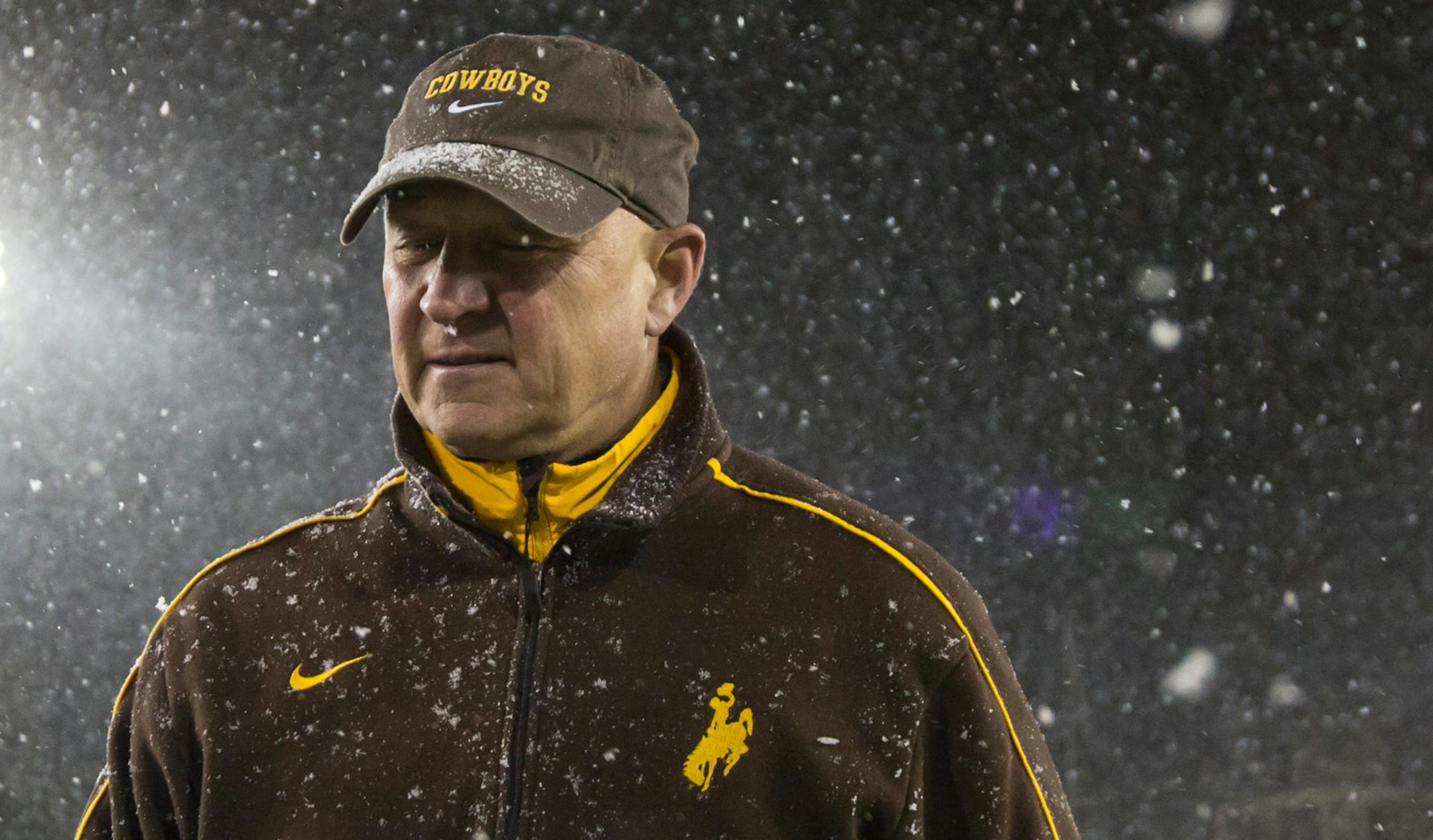 Wyoming head coach Craig Bohl leaves the field following a 63-14 loss to Boise State in a NCAA football game on Saturday, Nov. 22, 2014, at War Memorial Stadium in Laramie, Wyo. (AP Photo/Casper Star-Tribune, Ryan Dorgan)