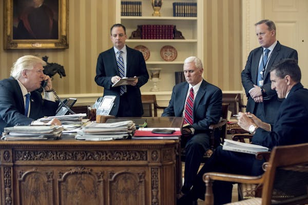 FILE - In this Jan. 28, 2017, file photo, President Donald Trump accompanied by, from second from left, Chief of Staff Reince Priebus, Vice President 