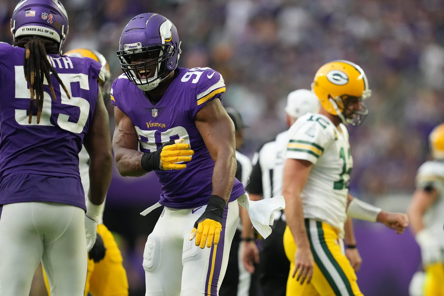 Minnesota Vikings linebacker Danielle Hunter (99) celebrates with fellow linebacker Za'Darius Smith (55) after sacking Green Bay Packers quarterback Aaron Rodgers (12) in the fourth quarter of the Minnesota Vikings season opener against the Green Bay Packers Sunday, Sept. 11, 2022 at U.S. Bank Stadium in Minneapolis. ] ANTHONY SOUFFLE • anthony.souffle@startribune.com