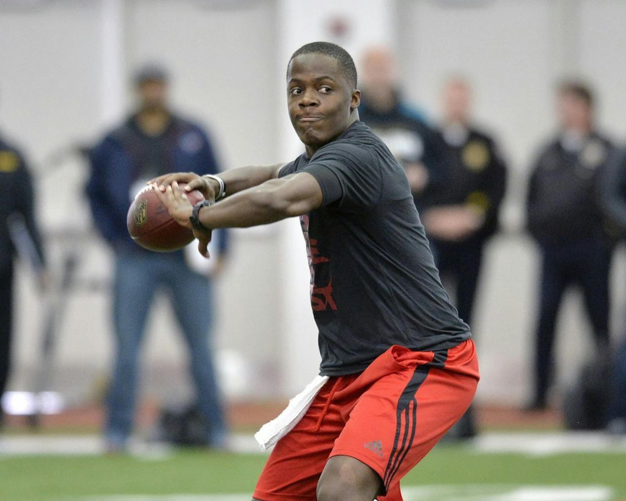 Louisville quarterback Teddy Bridgewater participates in a passing drill for NFL representatives during pro day at the University of Louisville in Louisville, Ky., Monday, March 17, 2014.