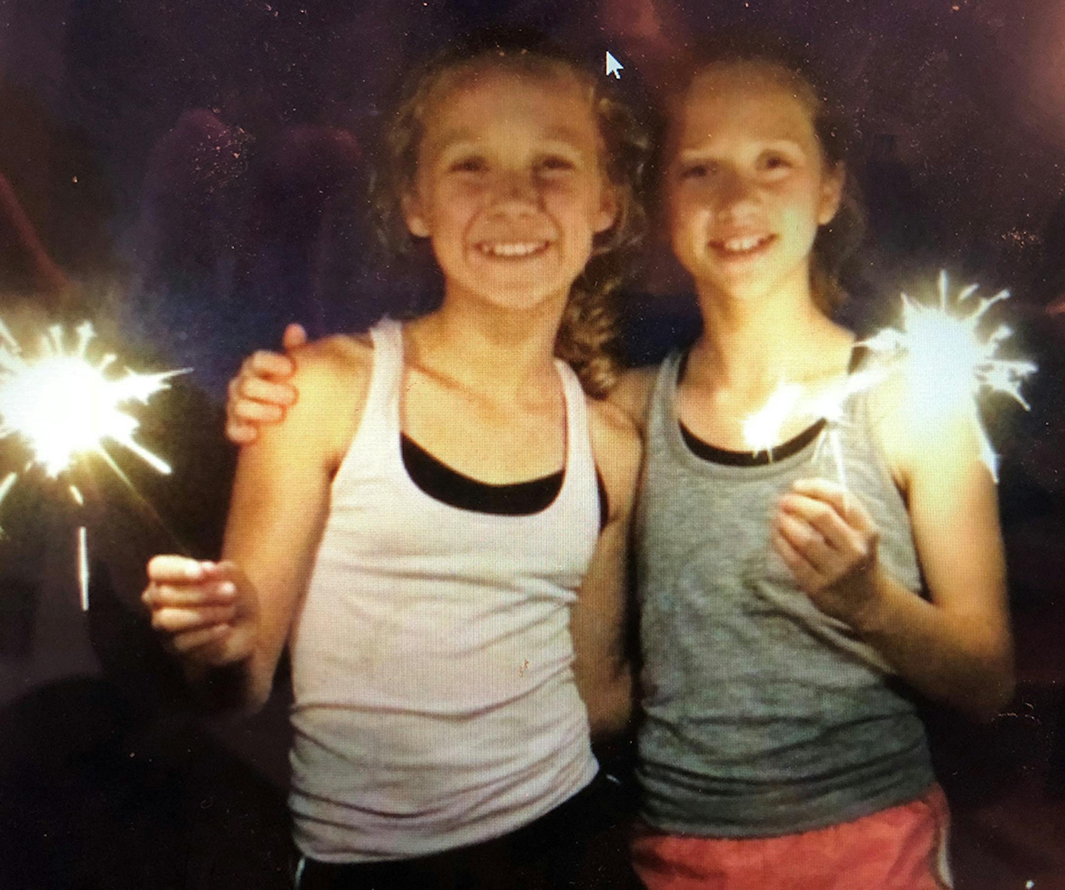 Jennifer Marx, from the Fourth of July in 2014. Friends (and neighbors) Cassie Max, left, and Olivia Seigler watch the fireworks over Mitchell Lake in Eden Prairie, a decade-long tradition.