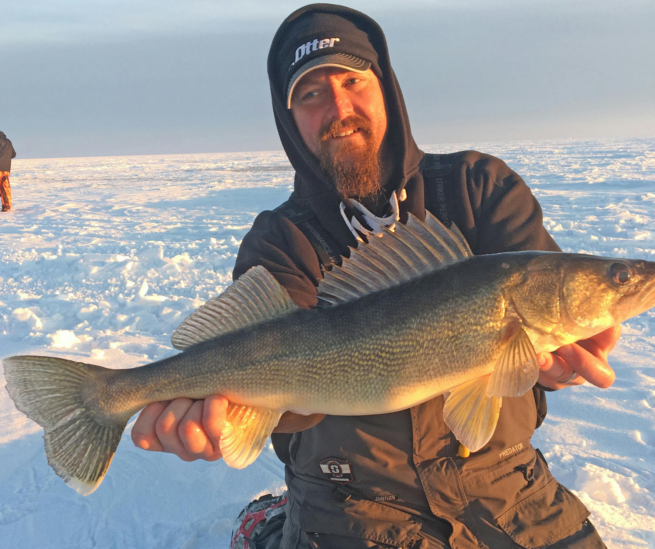 Pete Frish was surrounded by endless ice while hoisting a trophy walleye caught on Mille Lacs this winter.