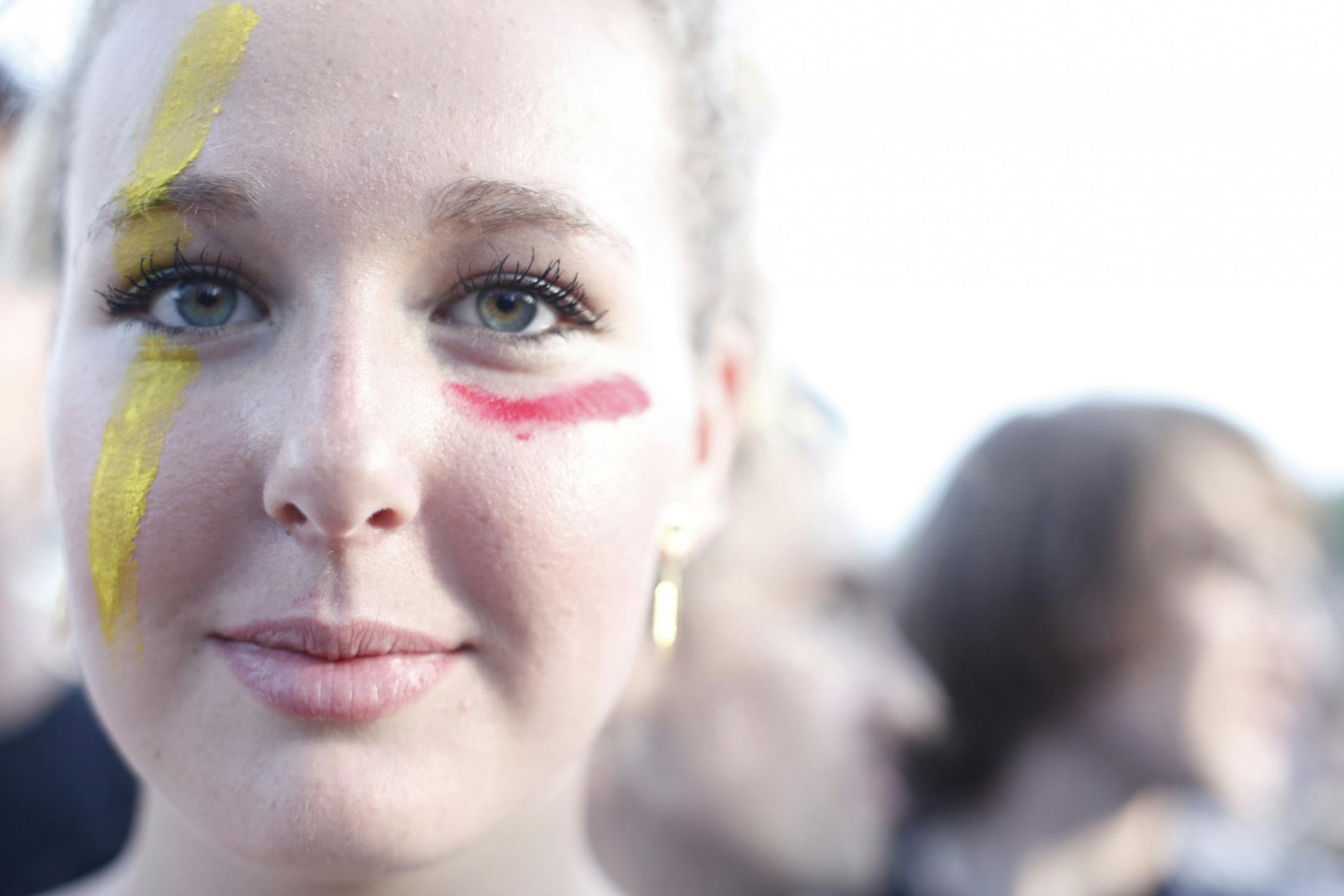 Molly Pohle, 15, stands in the front row of Tune-Yards performance with a painted face that mimics the lead singer Merrill Garbus's face paint at the 2012 Rock the Garden concert in Minneapolis, Minn. on Saturday, June 16, 2012.