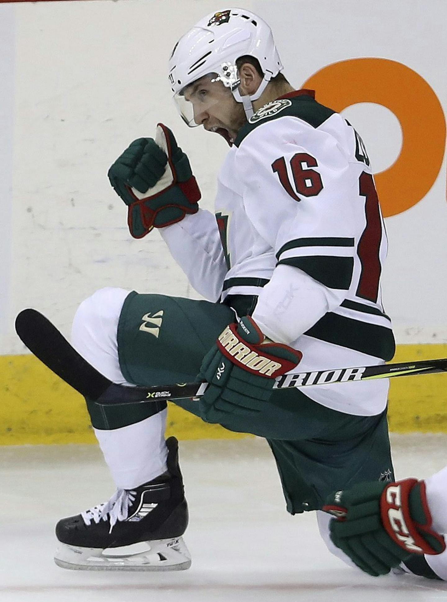 Minnesota Wild's Jason Zucker (16) celebrates with Erik Haula (56) after Zucker scored against the Winnipeg Jets during the third period of an NHL hockey game Tuesday, Feb. 28, 2017, in Winnipeg, Manitoba. (Trevor Hagan/The Canadian Press via AP)