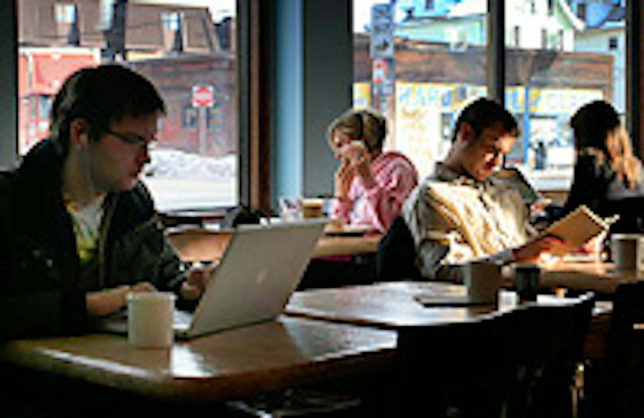 Patrons enjoy reading, working on their computer and even enjoy lunch and coffee on a late sunny afternoon.