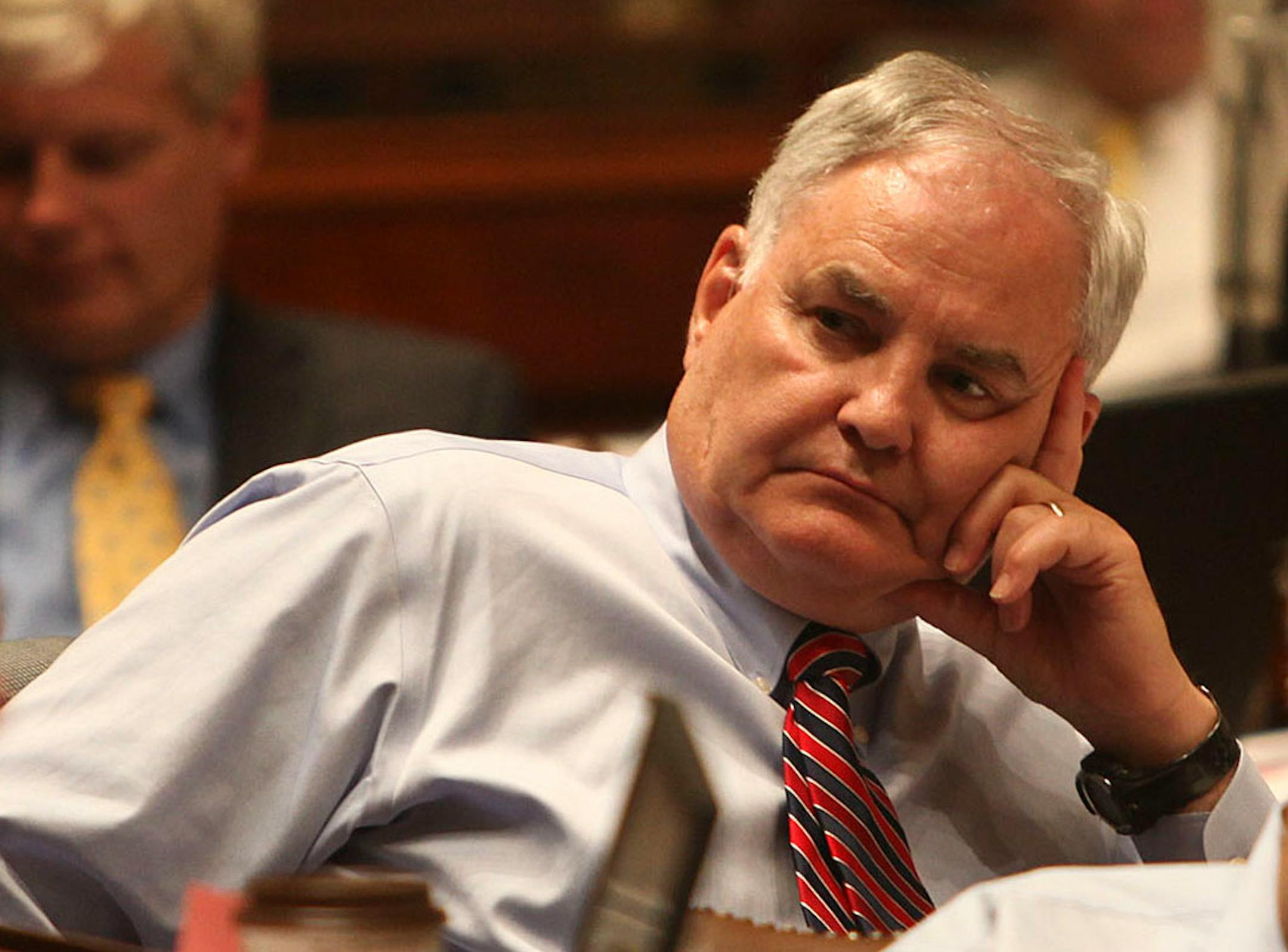 Rep. Lyndon Carlson (DFL) listened to Rep. Paul Marquart (DFL) talked to the House as he planned to vote no on the tax bill during the special session at the Capitol in St. Paul , Minn., Tuesday, July 19, 2011. ] (KYNDELL HARKNESS/STAR TRIBUNE) kyndell.harkness@startribune.com