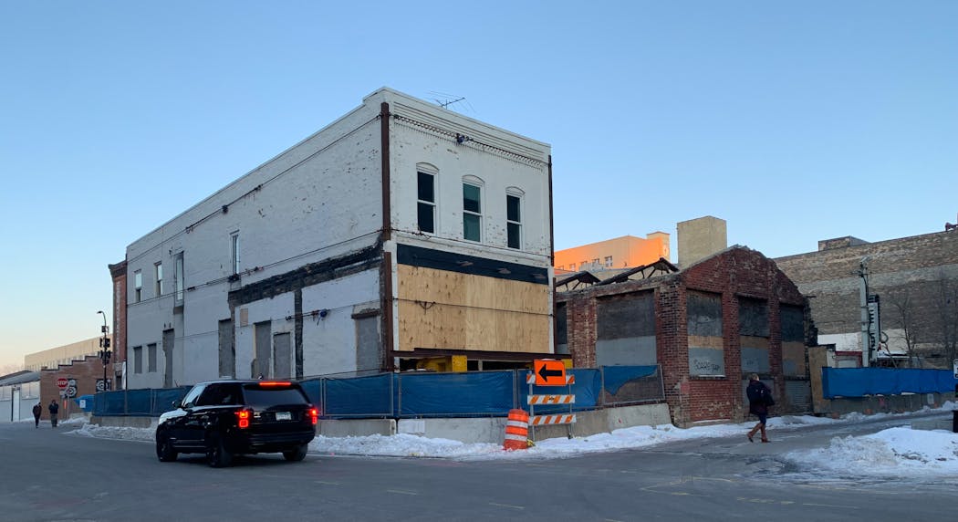 One of the vintage buildings temporarily moved a couple of blocks from the West Hotel project site during construction.