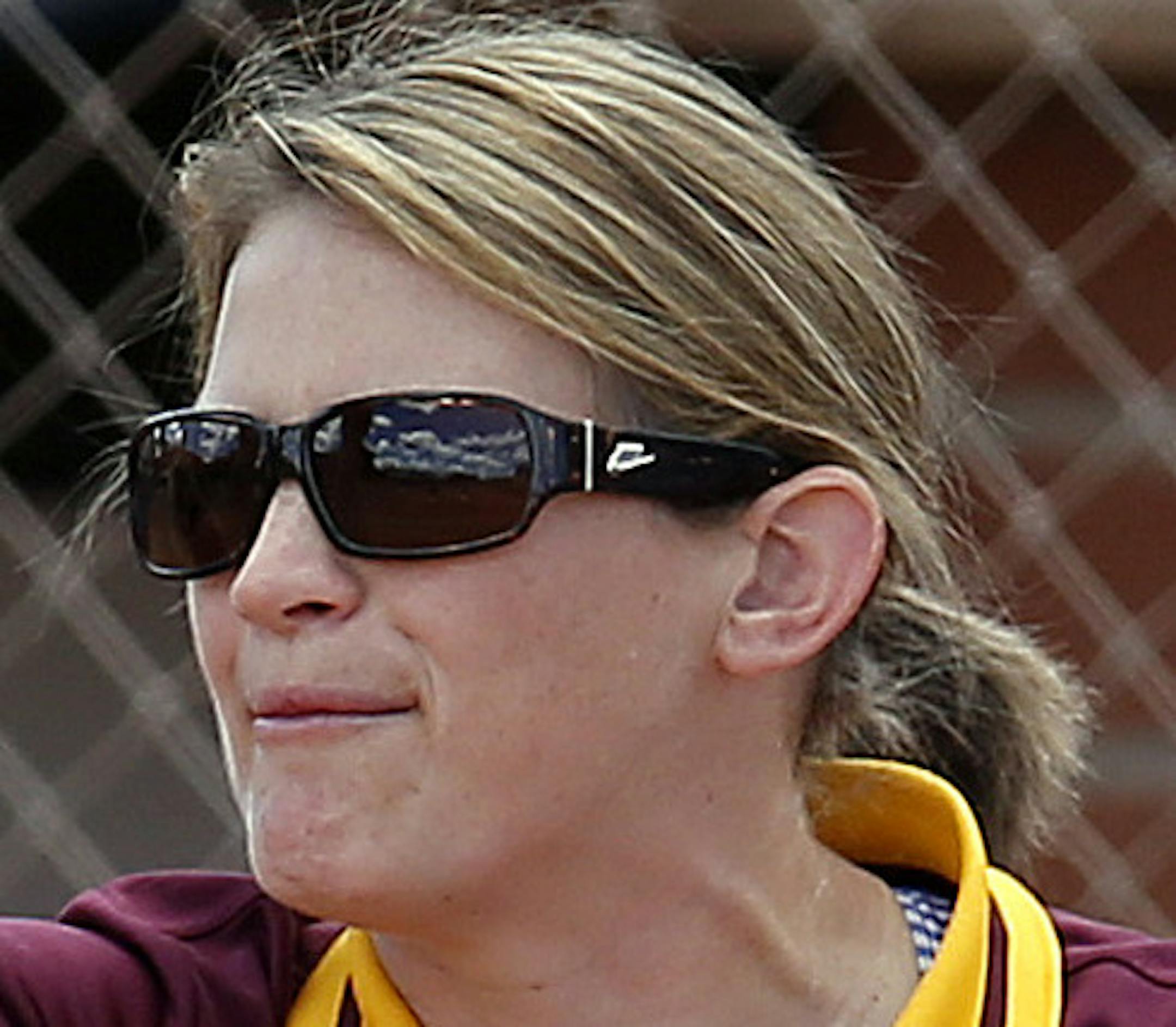 Minnesota head coach Jessica Allister, right, celebrates with Sara Groenewegen (17) in the fourth inning during an NCAA college softball tournament regional game against Arizona, Saturday, May 16, 2015, in Tucson, Ariz. (AP Photo/Rick Scuteri) ORG XMIT: AZRS113