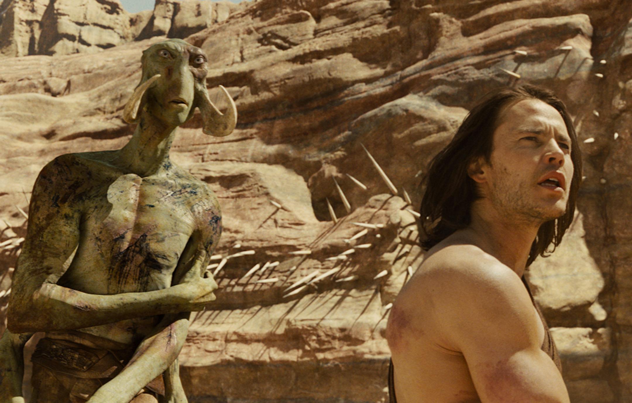 Willem Dafoe, who plays Tars Tarkas a nine foot martian, and Taylor Kitsch, who plays John Carter, in a scene from epic science fiction film "John Carter."