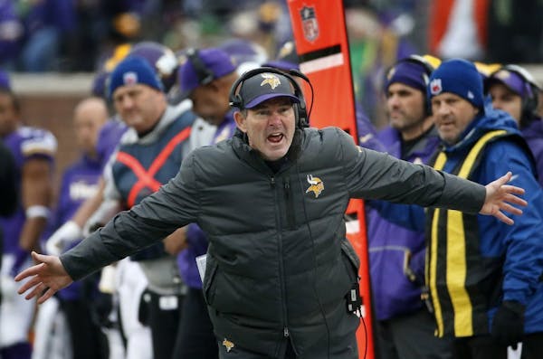Minnesota Vikings head coach Mike Zimmer argues a call against the Seattle Seahawks in the second half of an NFL football game Sunday, Dec. 6, 2015 in