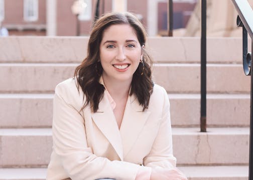 photo of author Ellie Palmer on a staircase