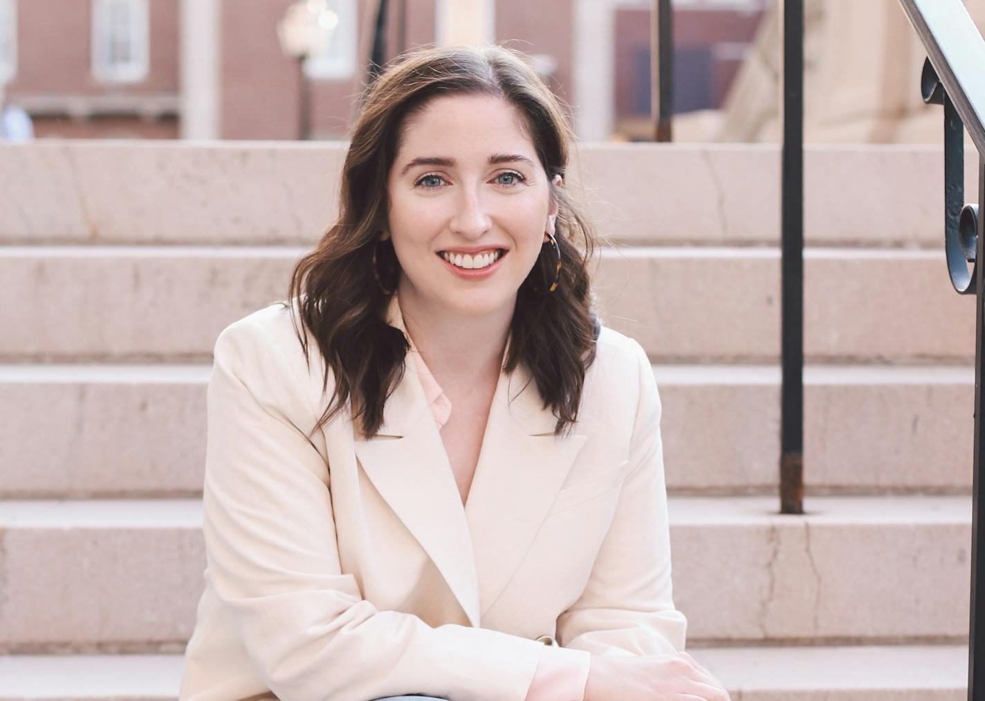 photo of author Ellie Palmer on a staircase