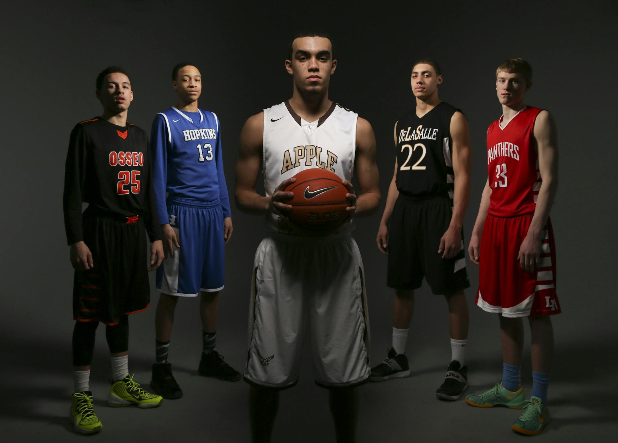 The Star Tribune's all-metro basketball team gathered for a group portrait Sunday afternoon. They are, from left, Wheeler Baker, Osseo; Amir Coffey, Hopkins; Player of the Year Tyus Jones, Apple Valley; Reid Travis, DeLaSalle; J.P. Macura, Lakeville North.