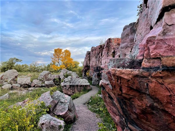 Pipestone National Monument’s Circle Trail winds through pink quartzite formations and tallgrass prairie.