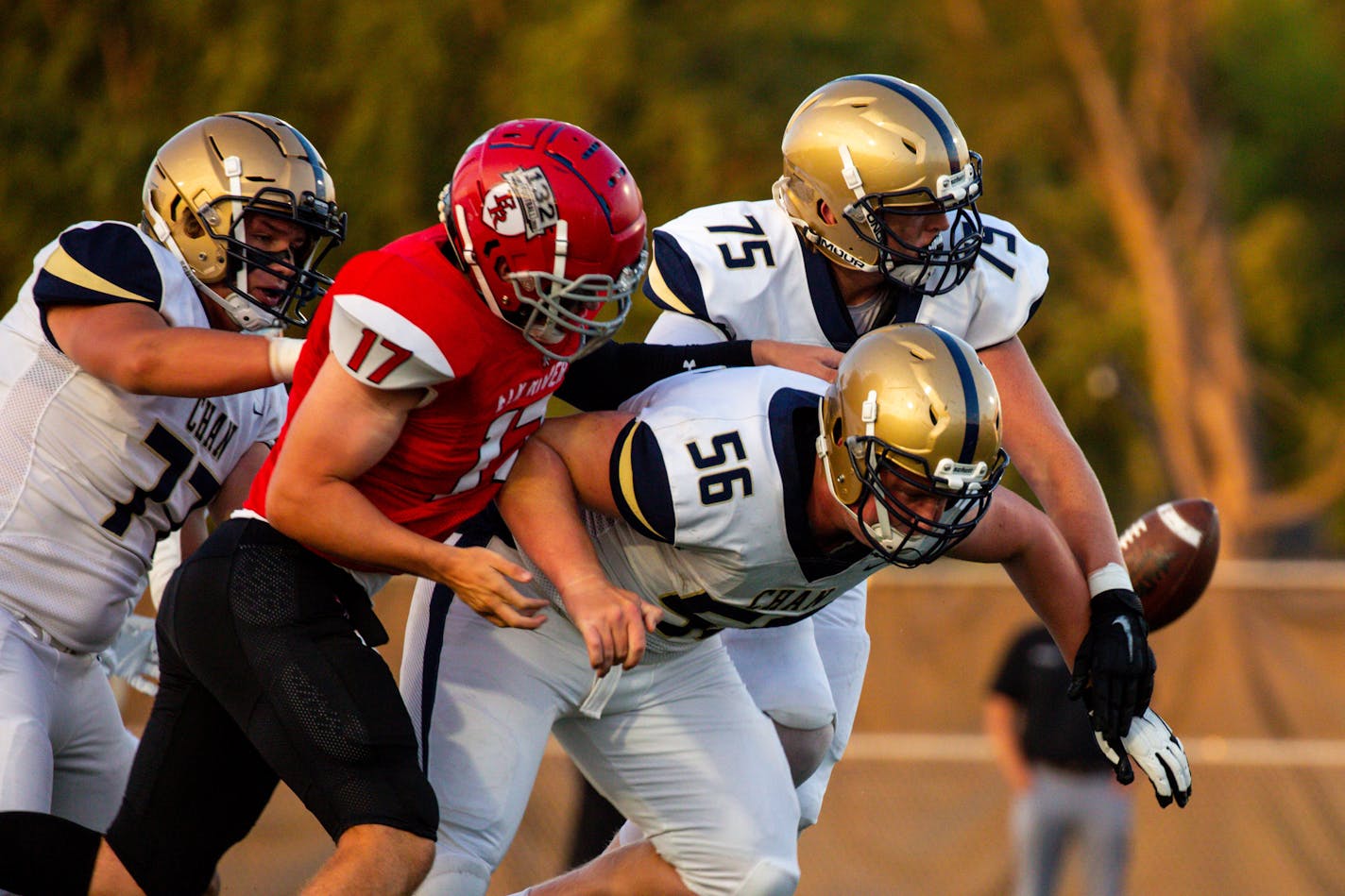 Chanhassen offensive lineman Owen Linder (75) fumbles a pass.