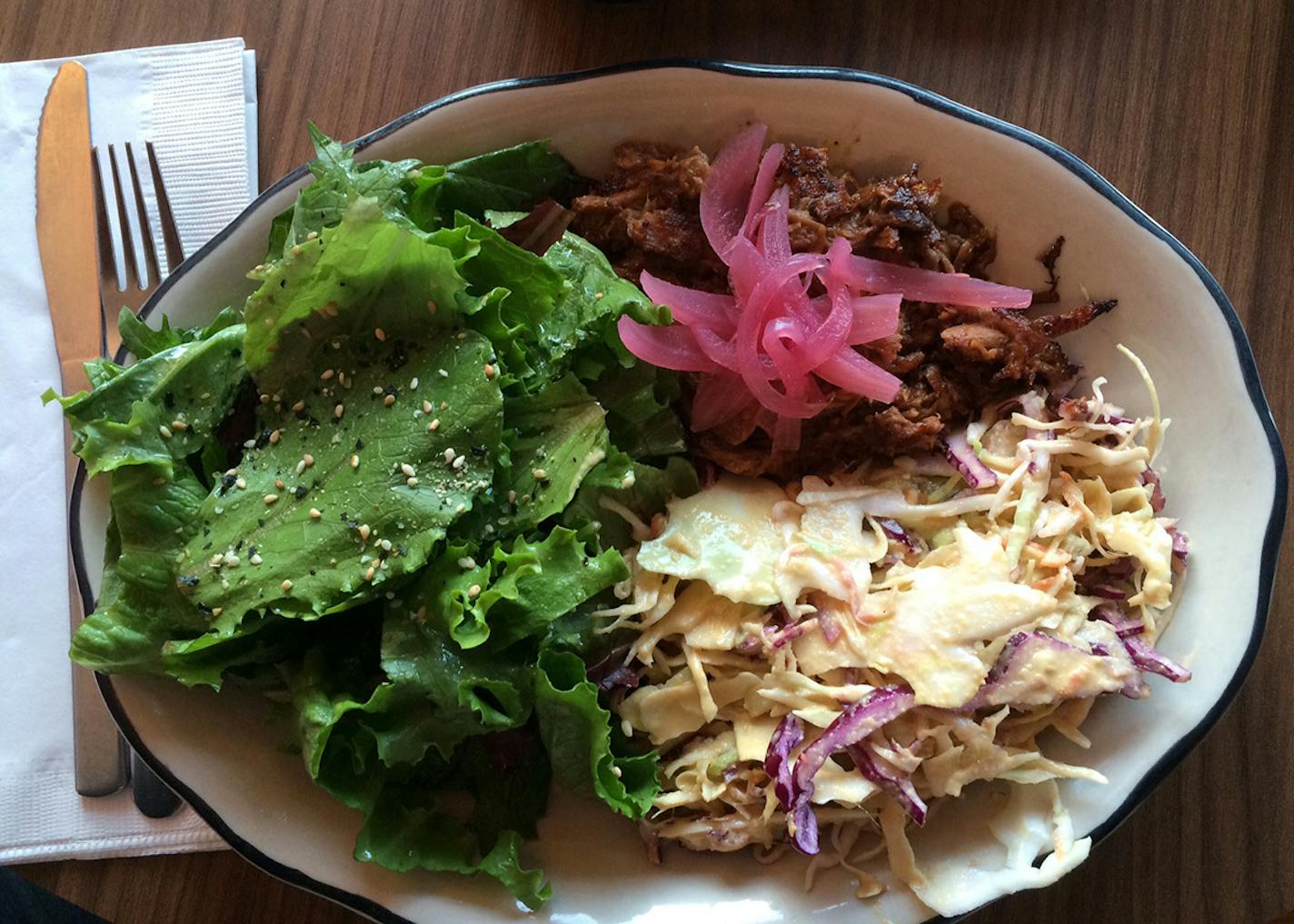 Photo by Rick Nelson Slow-roasted, miso-scented, Minnesota-raised pork, sassily served with a tangy ginger slaw and pickled onions from the Sassy Spoon, which started as a food truck but now has a permanent location, too.