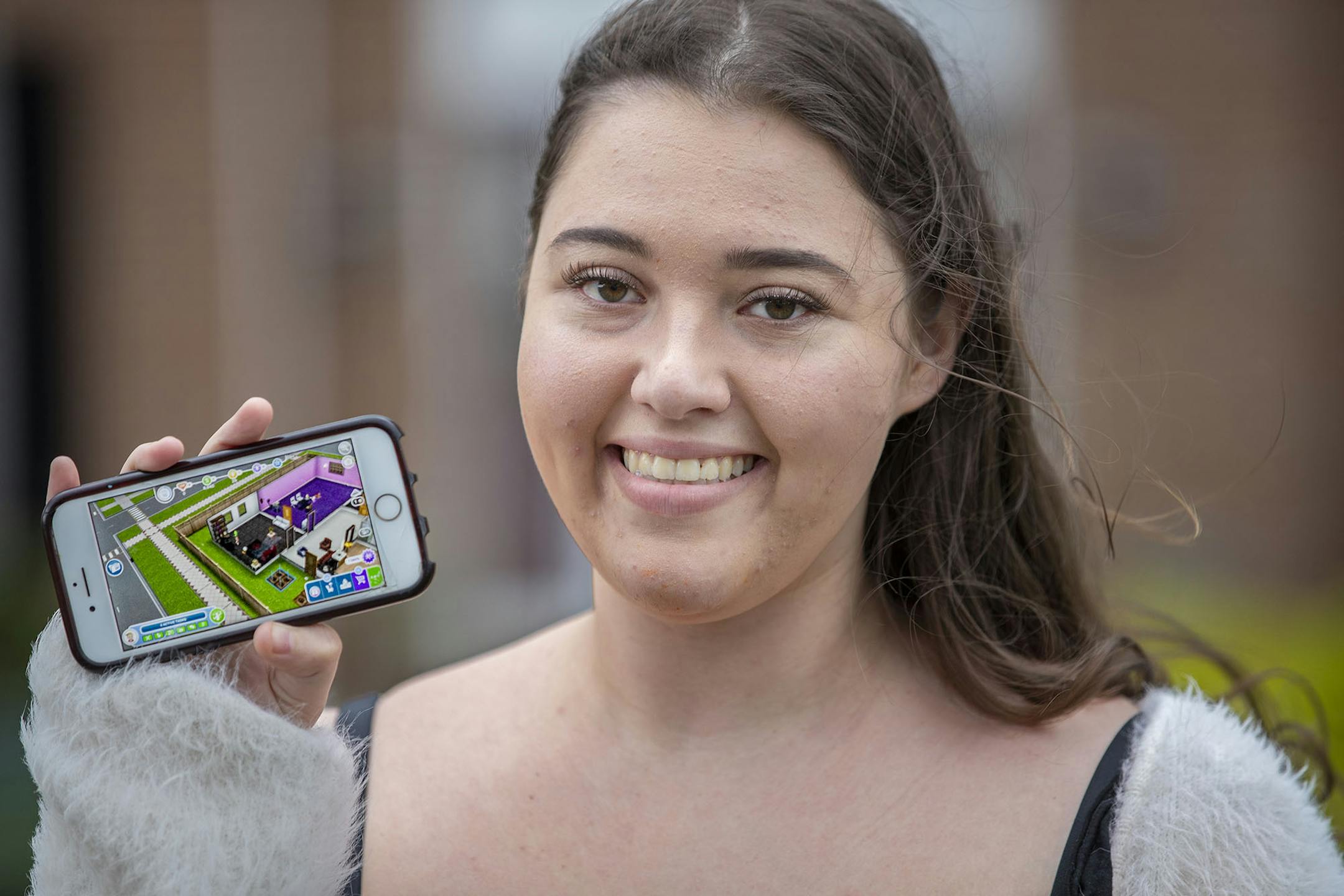 Abby Misbin, a Temple University senior who lives in Ambler, Pa., has begun playing Sims Freeplay to pass the time while she is stuck at home due to the coronavirus, on April 9, 2020. (Michael Bryant/The Philadelphia Inquirer/TNS) ORG XMIT: 1637110