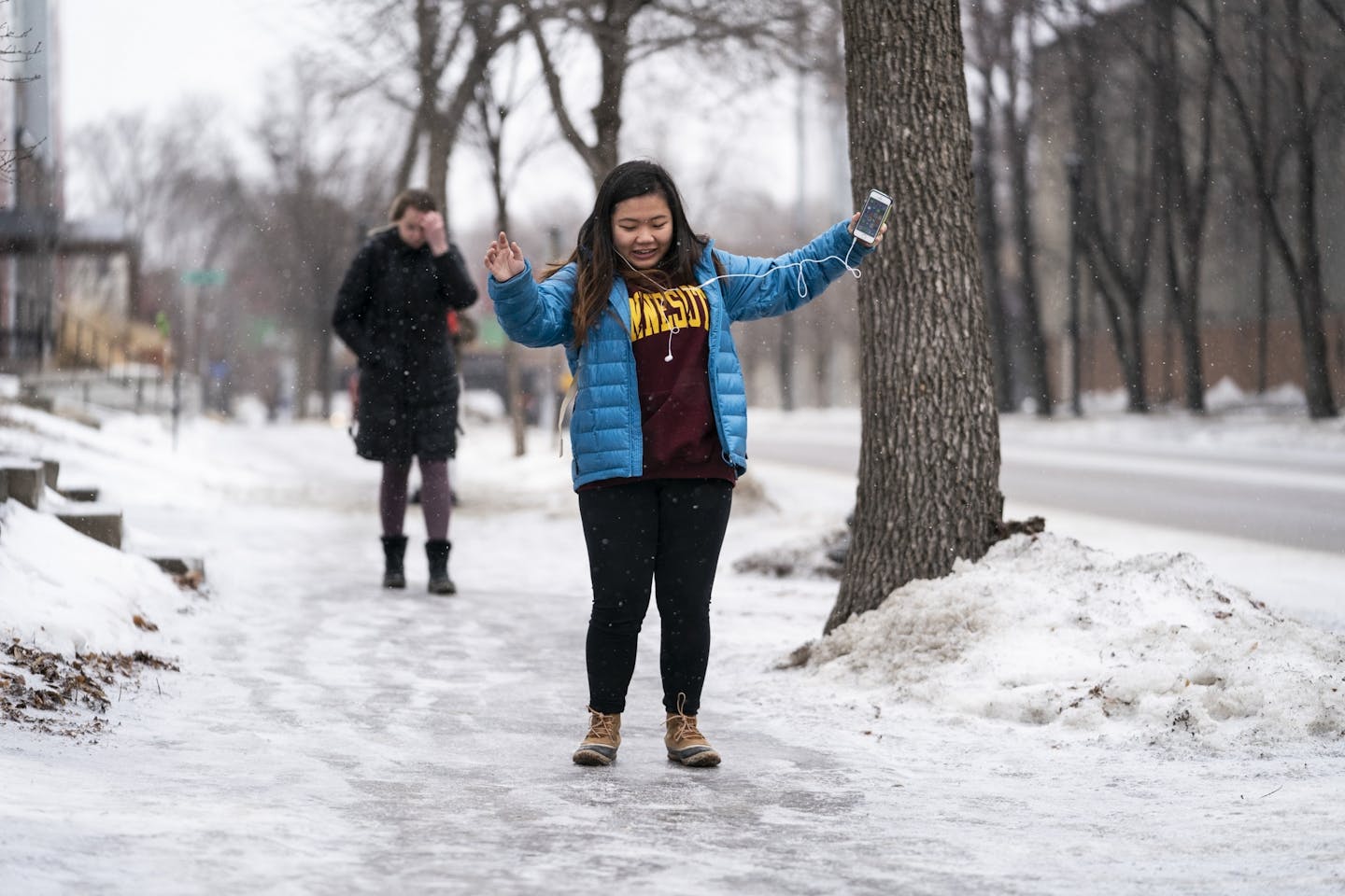 Annie Wong, 20, tried to keep her footing while walking to class at the University of Minnesota Monday.