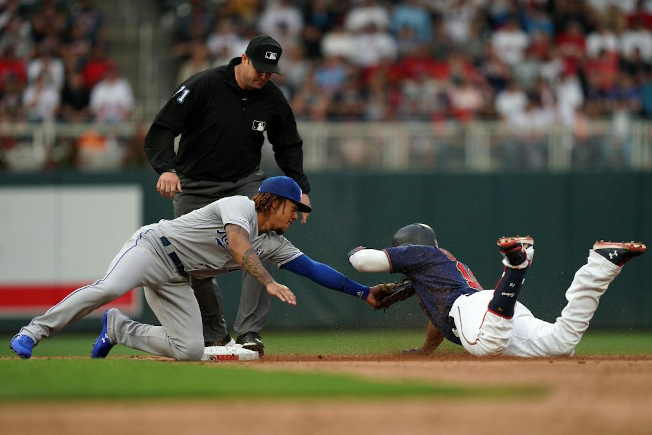 Minnesota Twins second baseman Jonathan Schoop (16) was tagged out at second by Kansas City Royals second baseman Adalberto Mondesi (27) in the third inning.