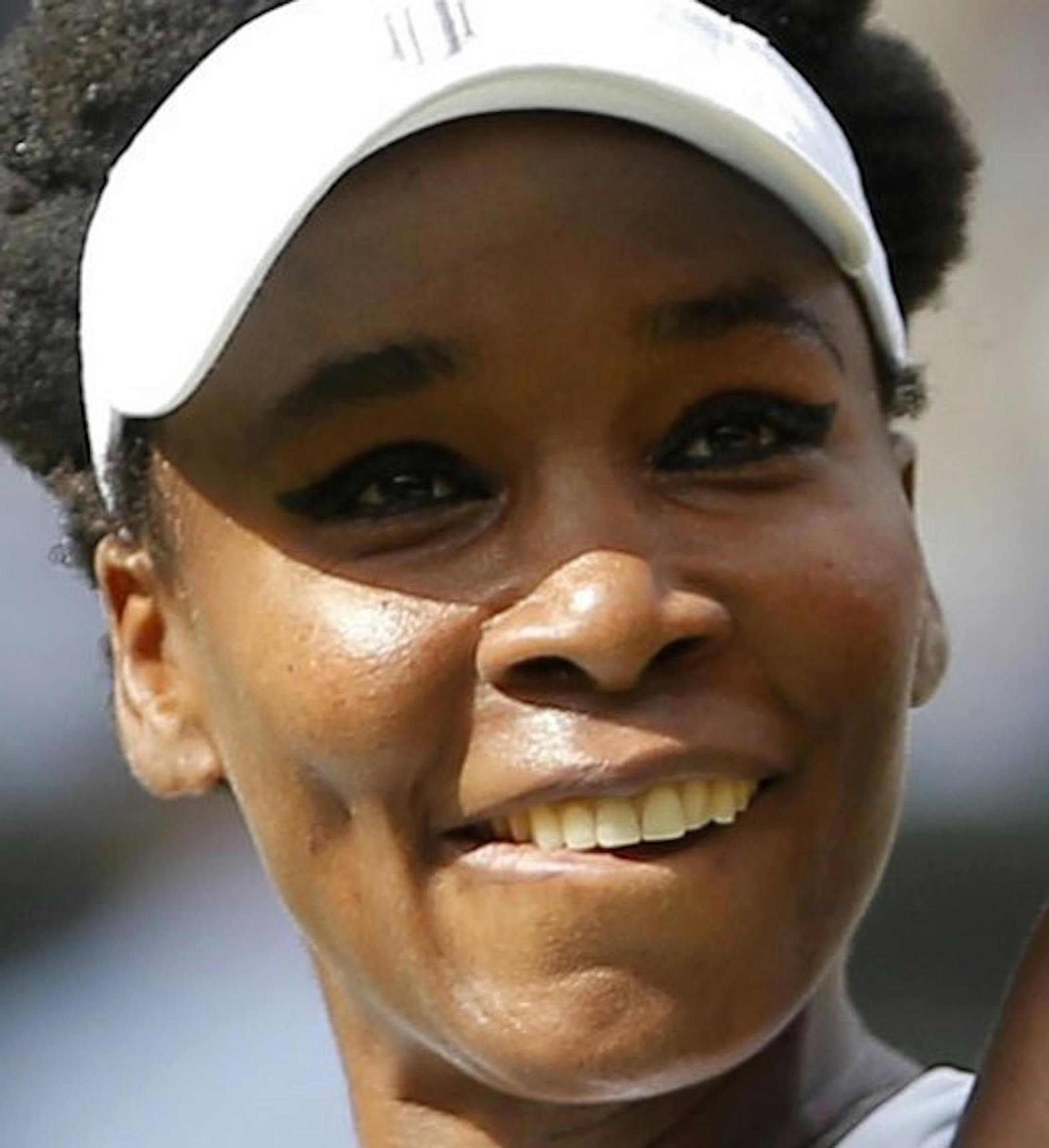 Venus Williams of the United States waves after beating Britain's Johanna Konta in their Women's Singles semifinal match on day nine at the Wimbledon Tennis Championships in London Thursday July 13, 2017. (Andrew Couldridge/Pool Photo via AP)