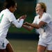 Eagan players Jade King(4) and Margaret Sipe(17) celebrated King's goal which made the score 2-0 .] In the quarterfinals of girls 2A soccer between Ea