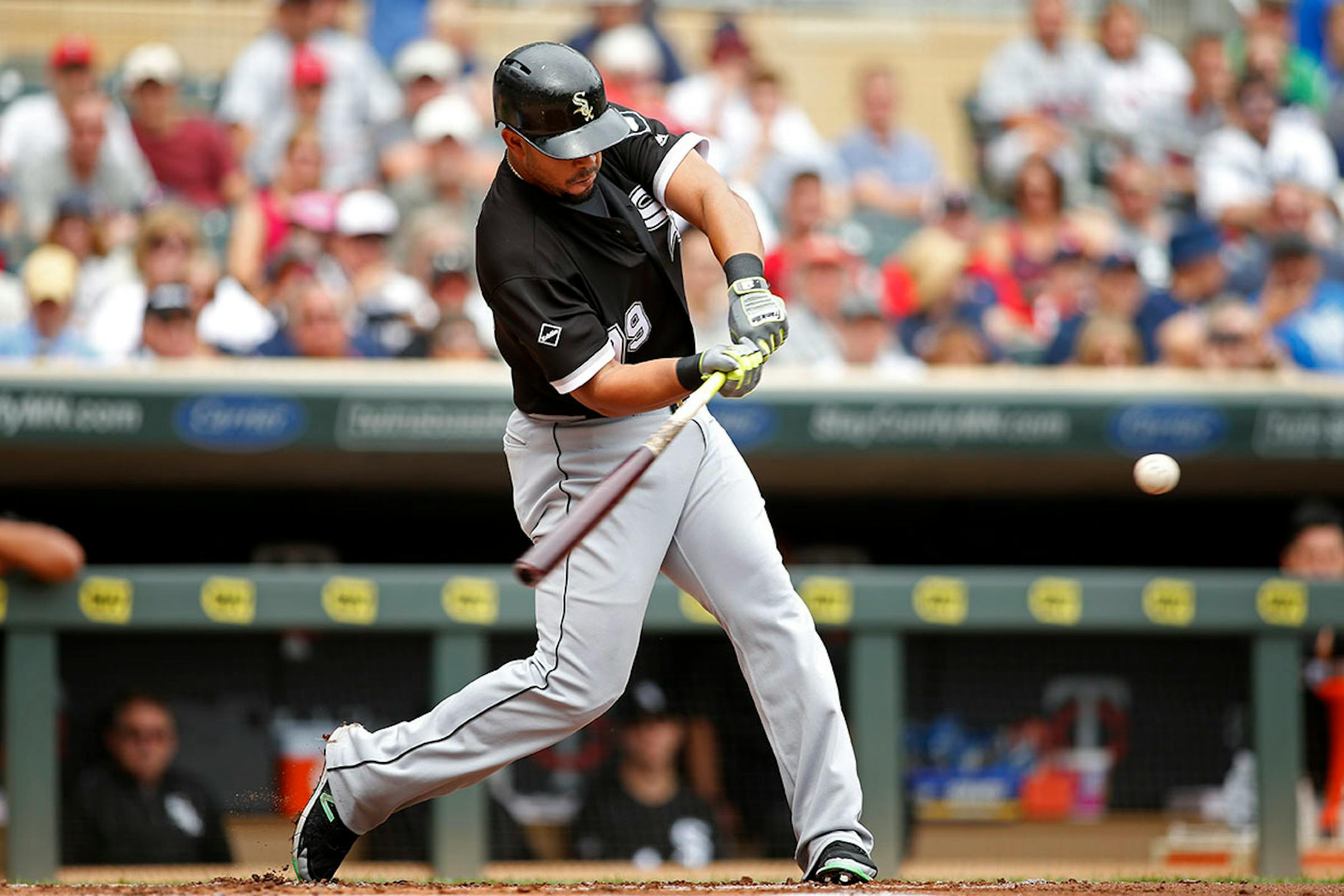 Chicago White Sox's Jose Abreu hits a three-run home run against the Minnesota Twins in the first inning of a baseball game Sunday, Sept. 4, 2016, in Minneapolis.