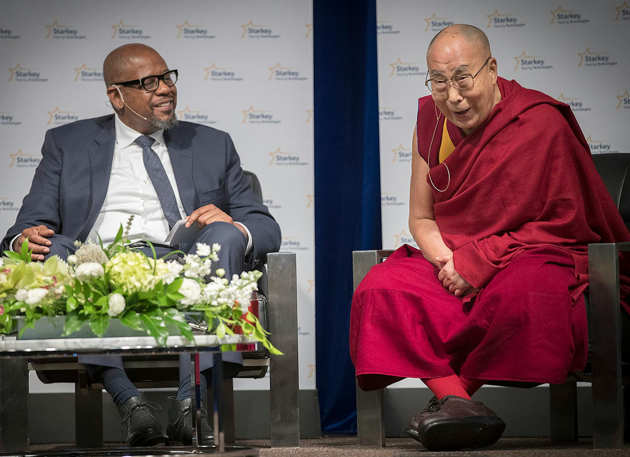 Actor Forest Whitaker and the Dalai Lama, who burst out in laughter, participated in a panel discussion at Starkey Hearing Technologies, Friday, June 23, 2017 in Eden Prairie, MN.