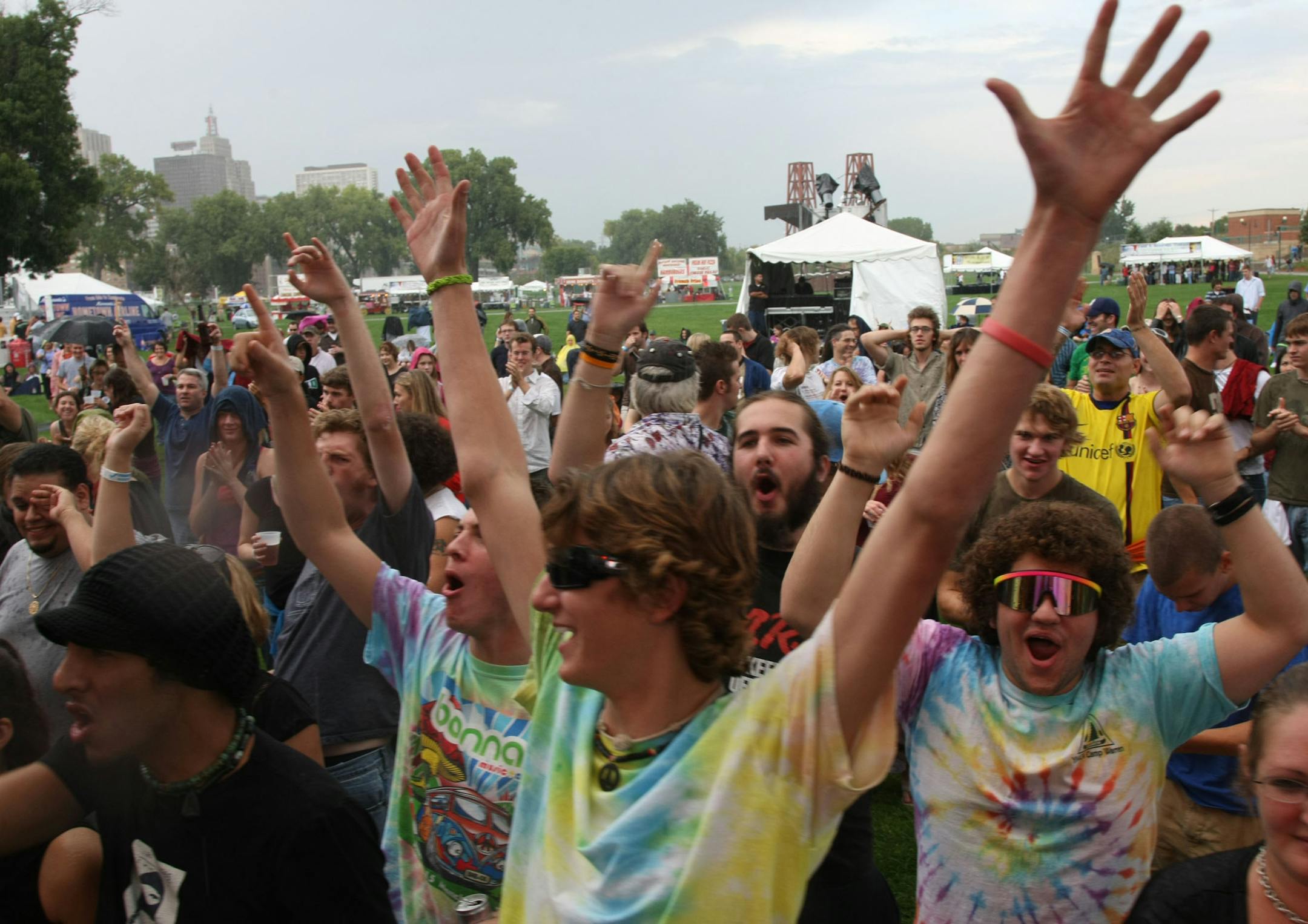 TOM WALLACE � twallace@startribune.comAssign:#00004871A slug: night0920 September 19, 2008The second annual McNally Smith River Rocks Festival has changed from an all-local two-day event to one with national headliners, including the Roots, Jakob Dylan, O.A.R., Mike Doughty and Live. Local favorites Semisonic, reuniting on Sat., still might be the big draw, though.[In the front row in colored t-shirts are, Ian Selleck Jake Boiesin front and Sreve Shannon. They are reacting to the second song o