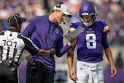 Minnesota Vikings head coach Kevin O'Connell, gave instructions to quarterback Kirk Cousins, (8) in the first half Minneapolis.,Minn. on Sunday Septem