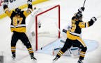 Pittsburgh Penguins' Sidney Crosby (87) and Patric Hornqvist, right, celebrate a goal by Conor Sheary against San Jose Sharks goalie Martin Jones (31)