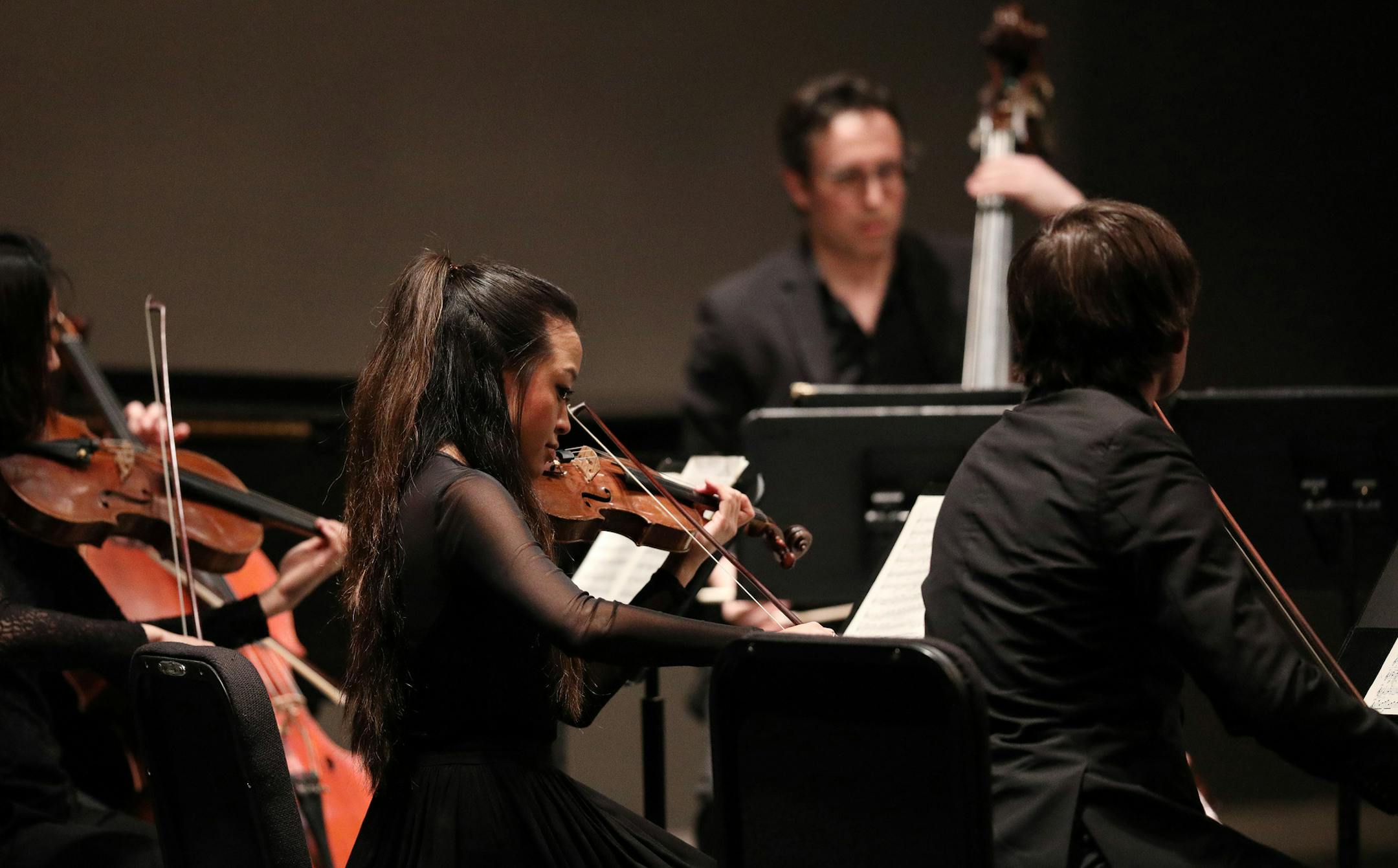 Violinist Eunice Kim performed with her fellow musicians during the St. Paul Chamber Orchestra's performance Friday. ] ANTHONY SOUFFLE • anthony.souffle@startribune.com Musicians from the St. Paul Chamber Orchestra performed Friday, May 11, 2018 at the Humboldt High School Auditorium in St. Paul, Minn. The St. Paul Chamber Orchestra has become a national model for innovation in the orchestra world.