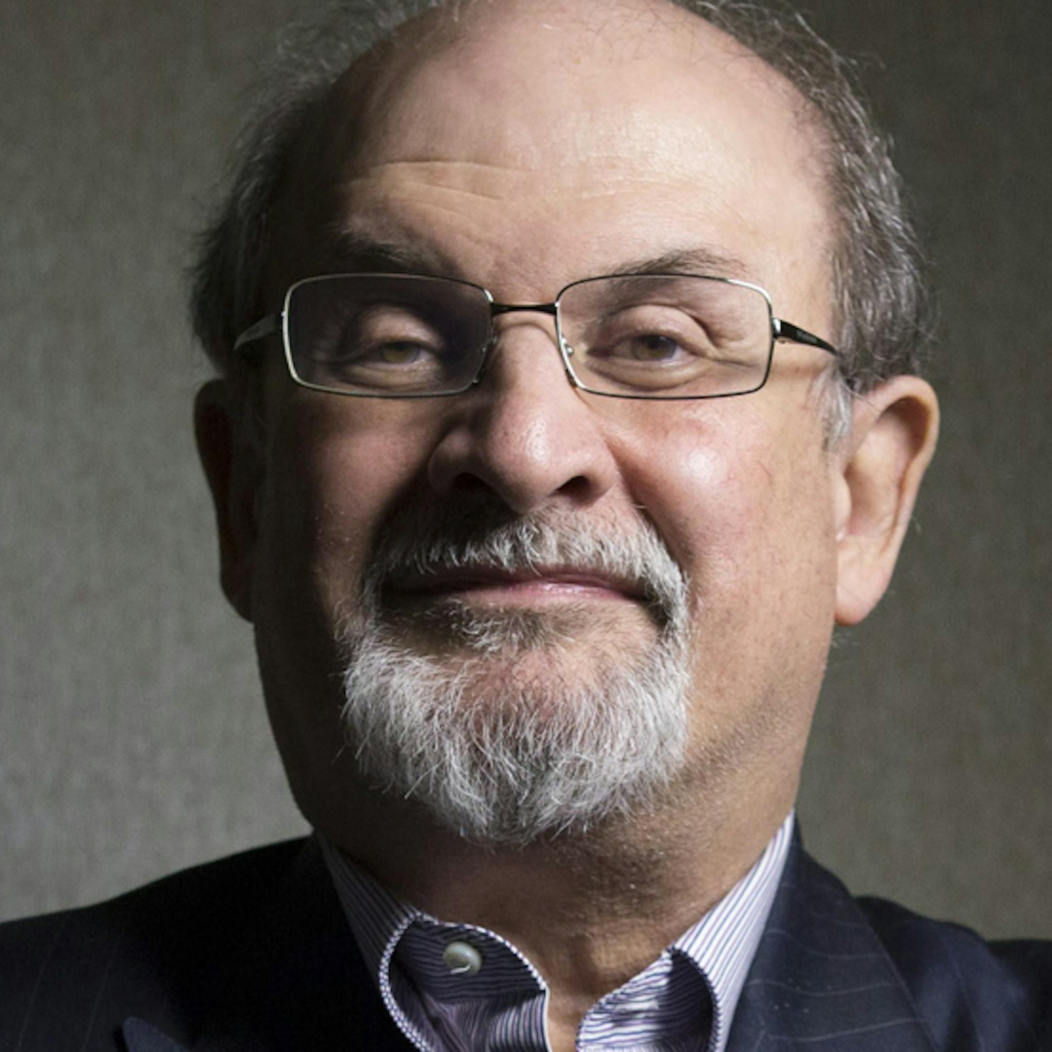 FILE - This Sept. 8, 2012 file photo shows author Salman Rushdie posing during the 2012 Toronto International Film Festival in Toronto. Rushdie is promoting the film adaptation of his breakthrough novel, "Midnight's Children," winner of the Booker Prize in 1981 and one of the most highly praised works of fiction of its time. (AP Photo/The Canadian Presss, Chris Young, file)
