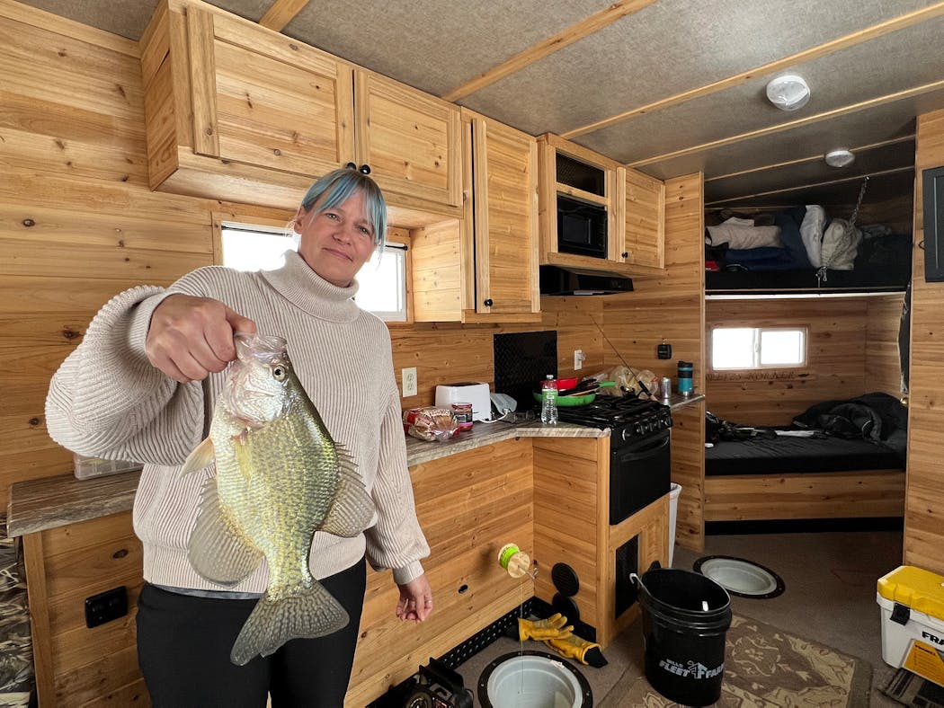 Samantha “Sam’’ Wheeler holds a 13-inch crappie caught on Upper Red Lake through the ice. The fish was reminiscent of the lake’s crappie explosion some years back before Upper Red’s walleye population was reborn.
