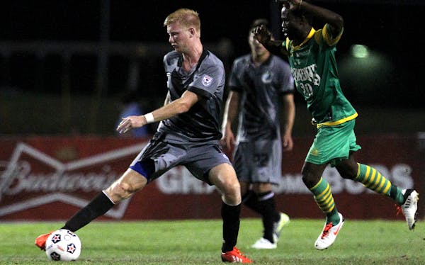Minnesota's Calum Mallace (16) extends for the ball as Tampa Bay's Evans Frimpong (20) chases after him in the Tampa Bay Rowdies vs. Minnesota United 