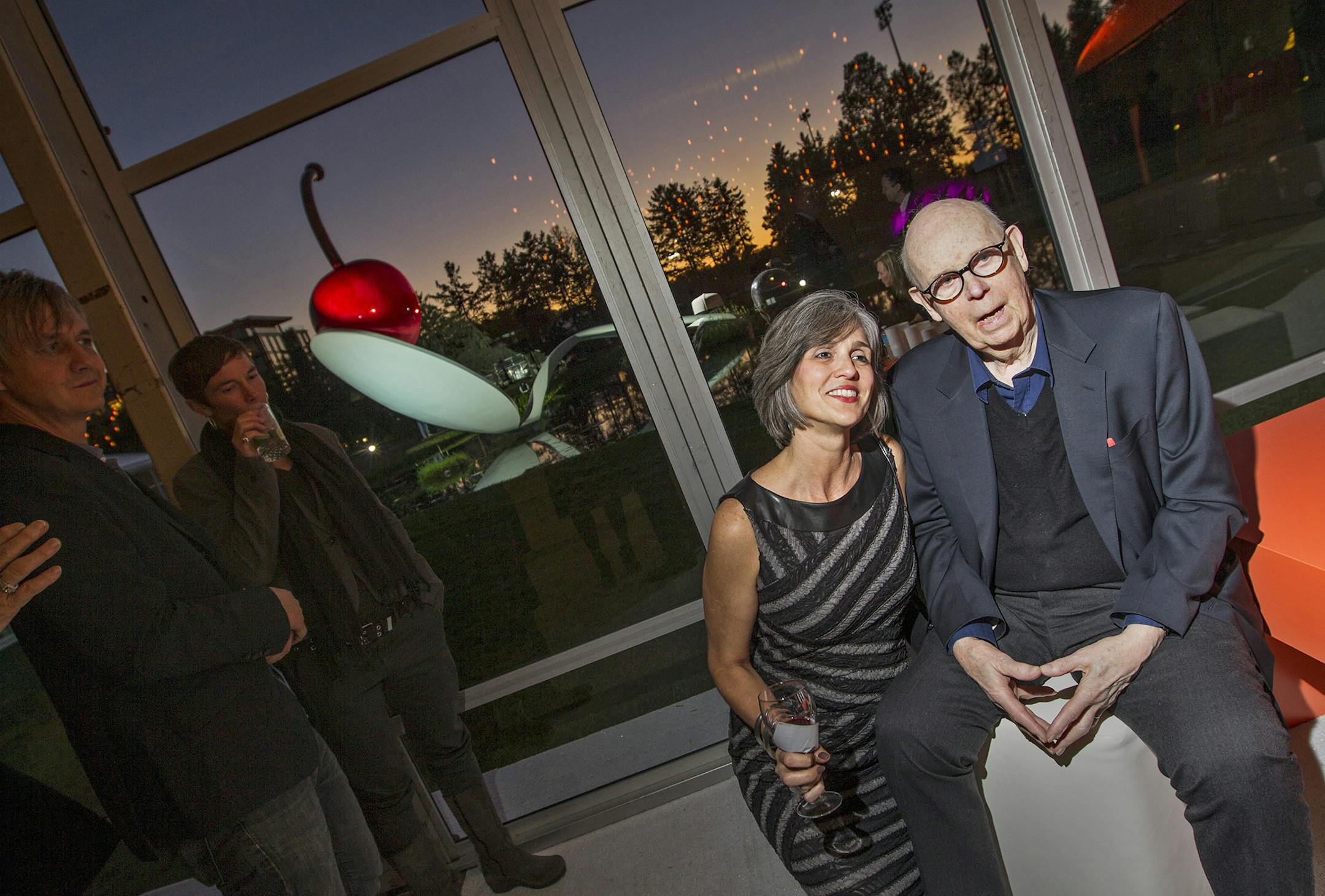 Claes Oldenburg posed with Walker Art Center executive director Olga Viso, as Oldenburg's "Spoonbridge and Cherry" peeked through in the background at the Walker's Avant Garden gala September 21, 2013. (Courtney Perry/Special to the Star Tribune)