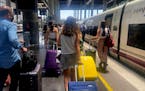 With luggage in tow, tourists arrive at a train station in Malaga, Spain, on June 14, 2021. (Claudia Nunez/Los Angeles Times/TNS) ORG XMIT: 42583359W