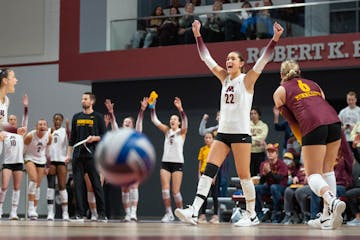 Minnesota outside Julia Hanson (22) celebrates with her teammates after winning a point in the first set against Purdue Friday, Nov. 10, 2023, at Matu