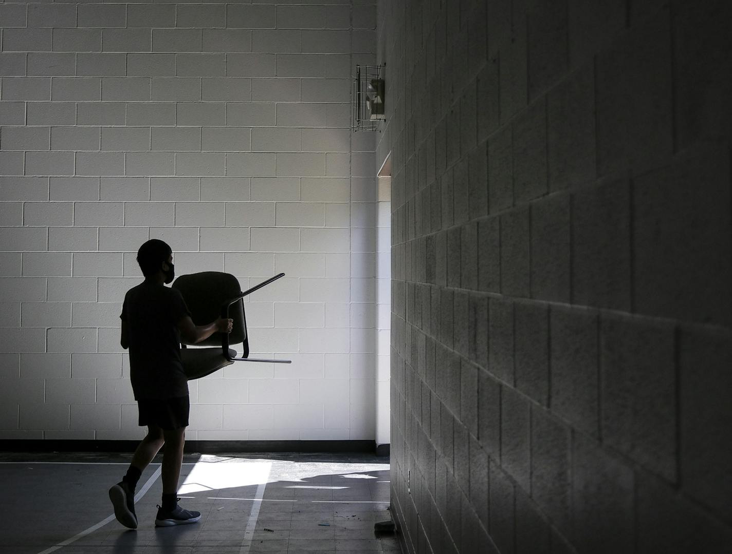 A student, whose mother didn't wish for him to be identified, helped move old furniture from Southview Christian School to a dumpster Wednesday afternoon. aaron.lavinsky@startribune.com As public schools anxiously await a state decision on whether they will reopen this fall, private schools -- which are not constrained by the decisions from the state Department of Education -- are making their own decisions. The Archdiocese announced last week that Catholic schools will be open, and many other p