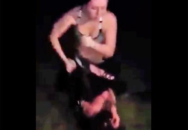 This video image from a Facebook posting shows Cassandra Borden beating a 15-year-old girl during an ambush in June.
