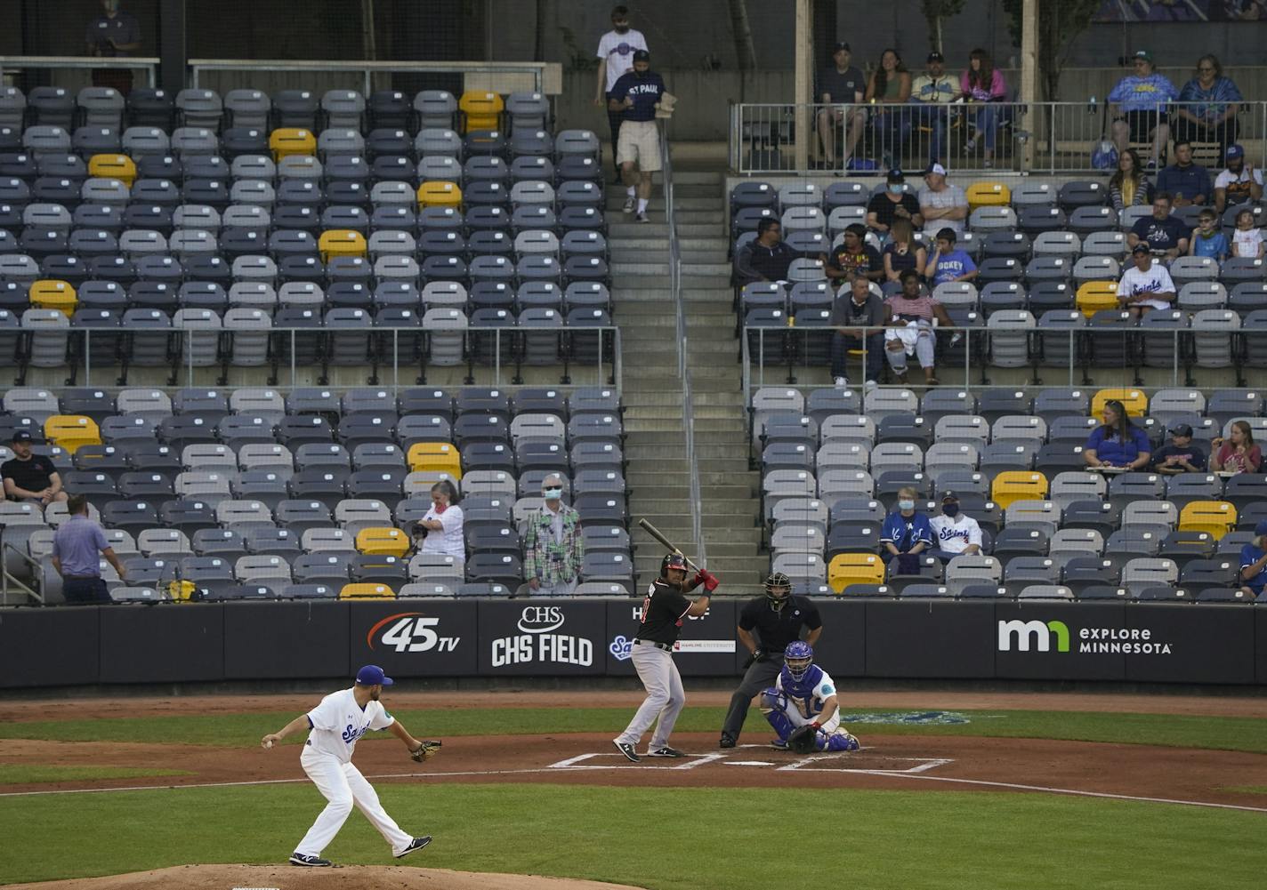 Saints starter Mike Devine threw a pitch Tuesday in the team's first true home game this season.