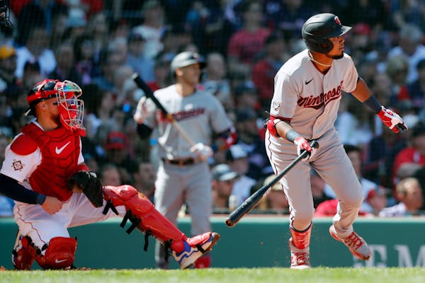 Luis Arraez watches his RBI single fall in front of Boston's Christian Vazquez on Friday in Boston
