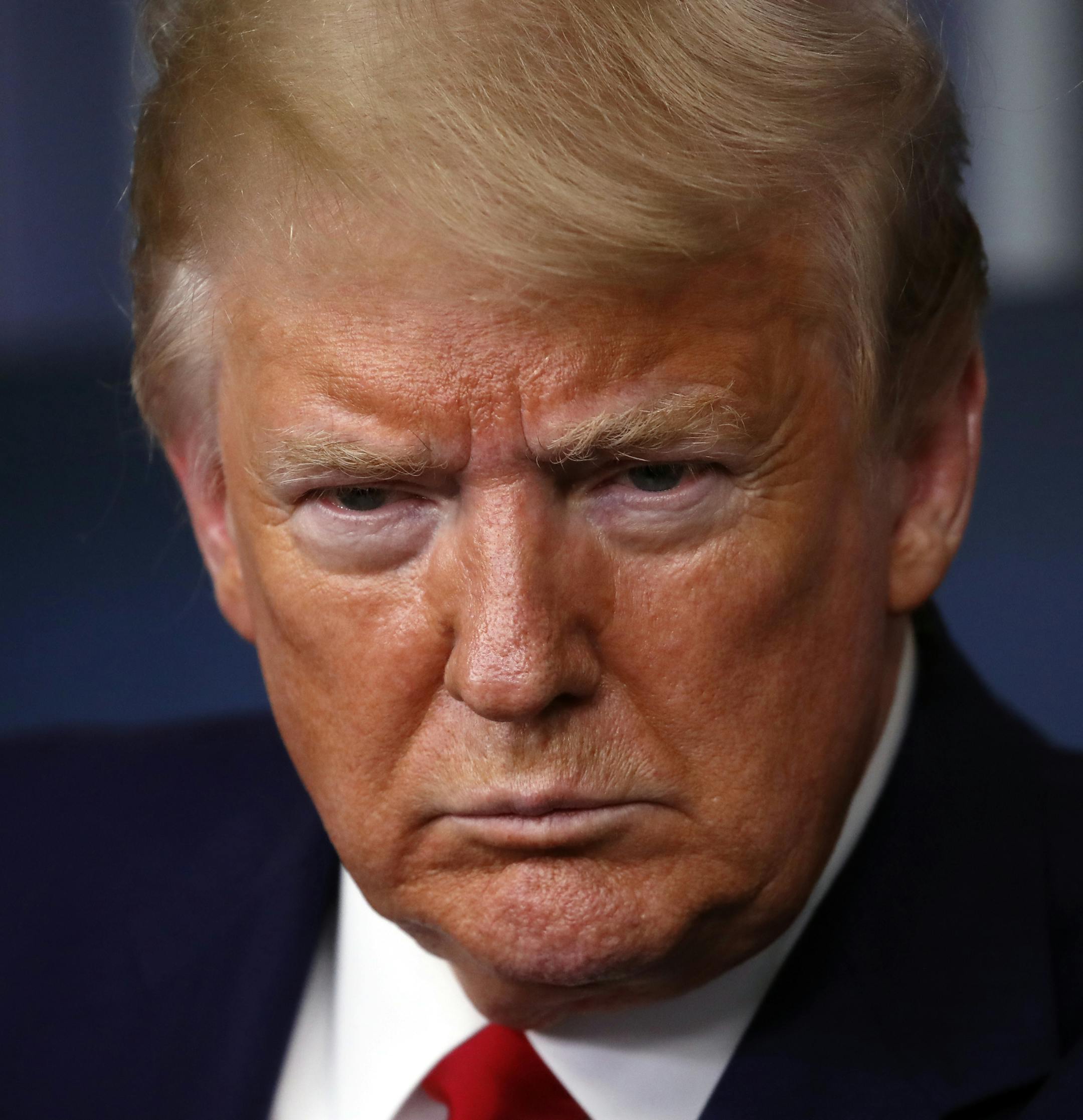 President Donald Trump listens to a question from a reporter as he speaks about the coronavirus in the James Brady Press Briefing Room of the White House, Monday, April 6, 2020, in Washington. (AP Photo/Alex Brandon)