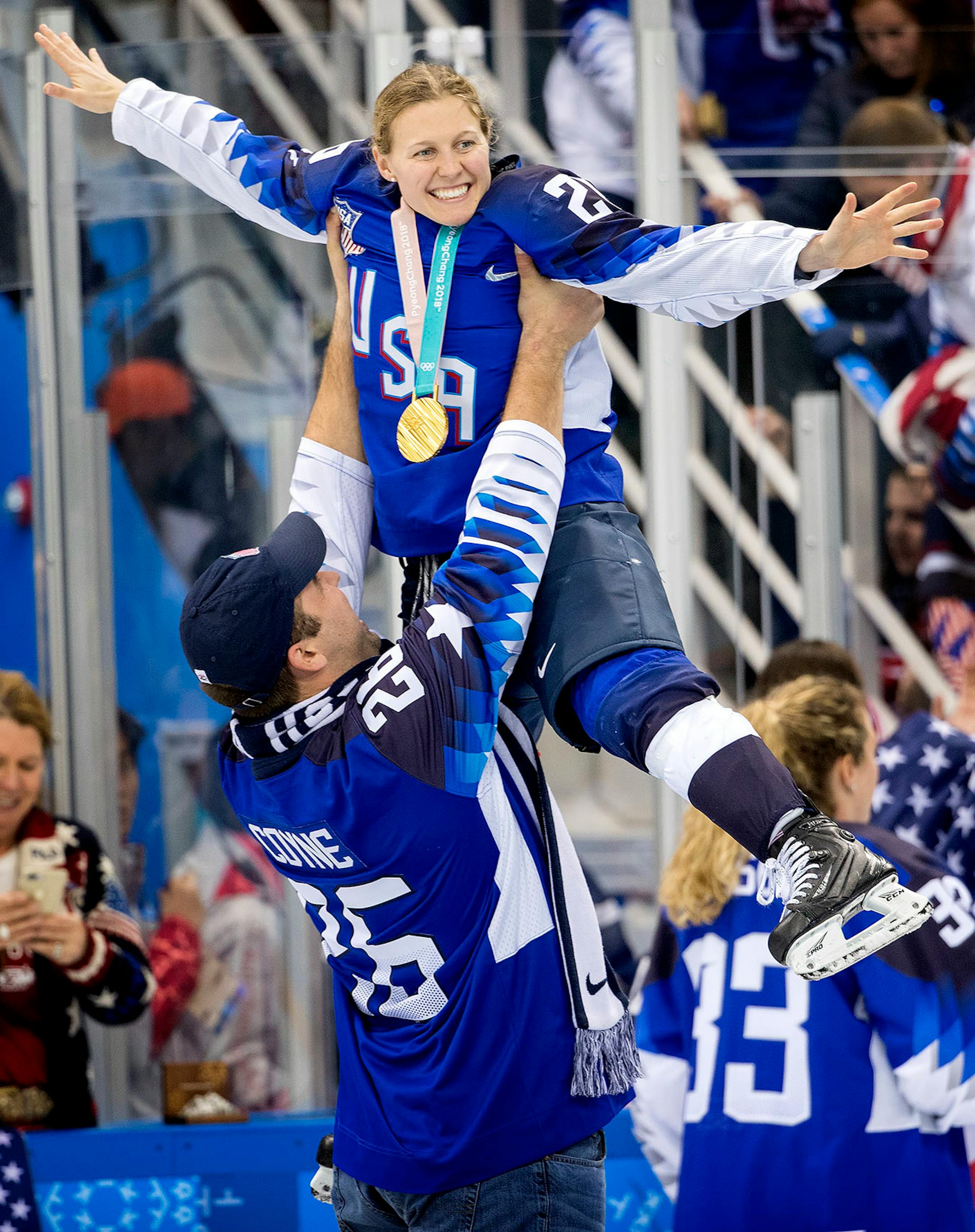 Kendall Coyne (26) was lifted up by her fiance Michael Schofield.