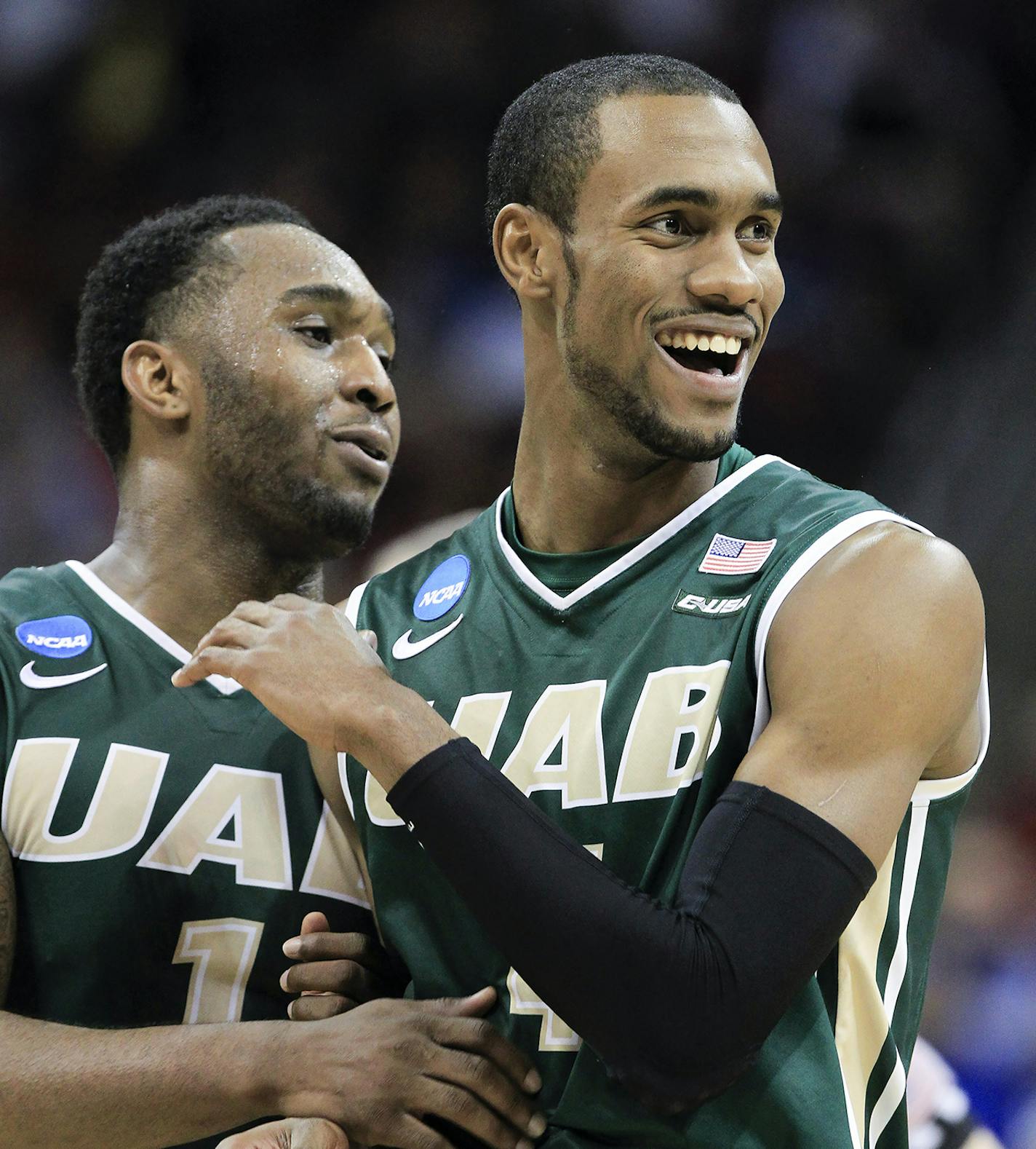 UAB guards Denzell Watts, left, and Robert Brown celebrate in the final seconds off their 60-59 win over Iowa State in the second round of the NCAA college basketball tournament in Louisville, Ky., Thursday, March 19, 2015. (AP Photo/David Stephenson) ORG XMIT: LOU118